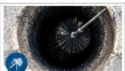Chimney cleaning brush inside a flue